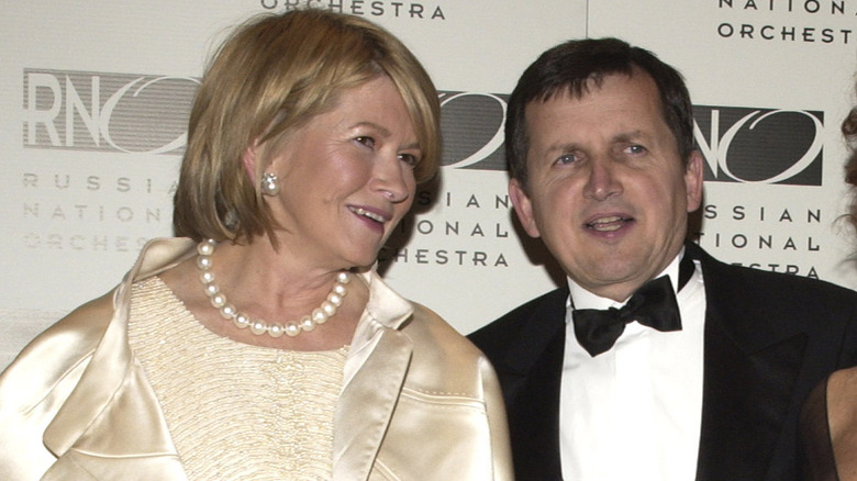 Martha Stewart and Charles Simonyi posing together alongside Sophia Loren.