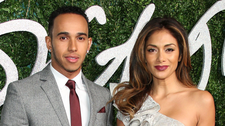 Lewis Hamilton and Nicole Scherzinger smiling