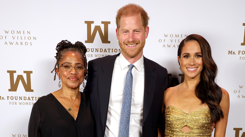 Doria Ragland, Prince Harry, and Meghan Markle at event