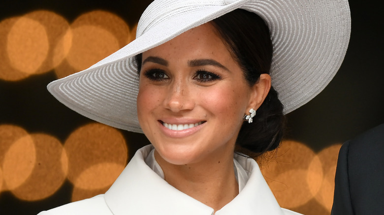 Meghan Markle wearing a white hat