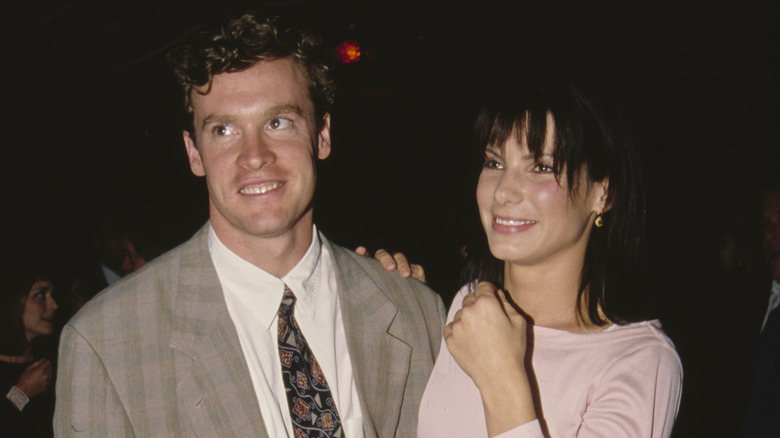 Tate Donovan and Sandra Bullock smiling