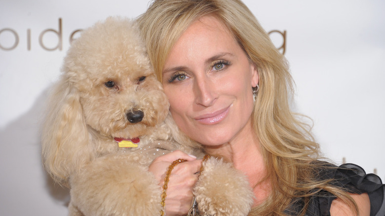 Sonja Morgan smiles with dog