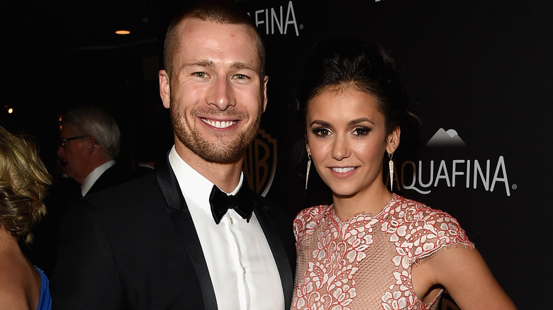 Glen Powell and Nina Dobrev smiling