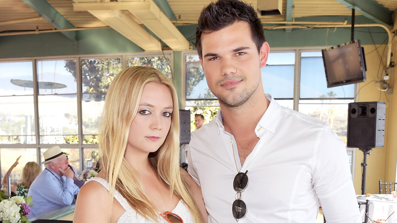 Billie Lourd and Taylor Lautner posing