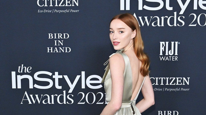 Phoebe Dynevor posing at event