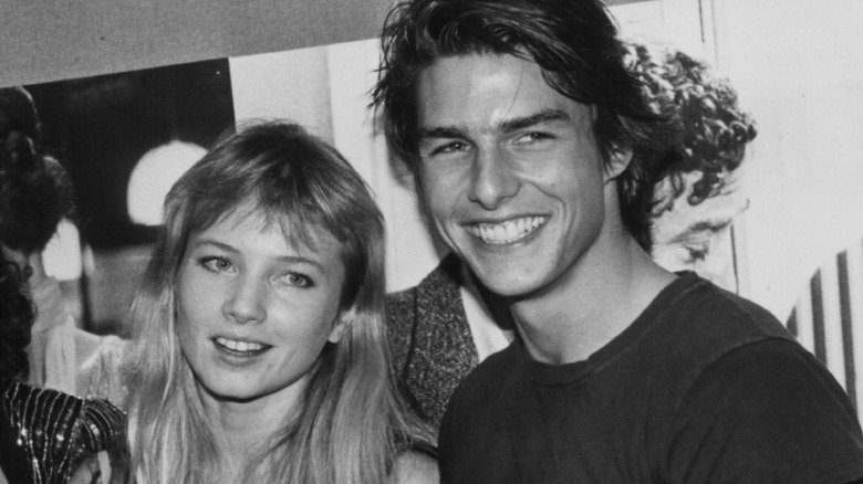 Rebecca De Mornay and Tom Cruise posing 