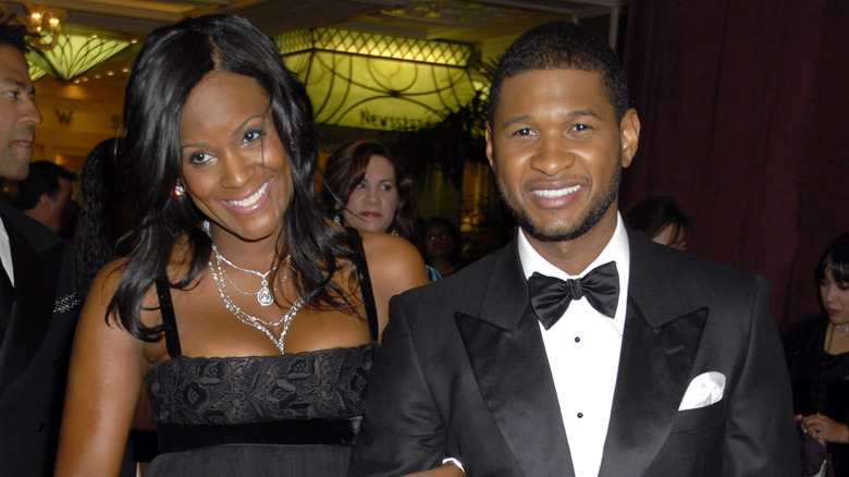 Tameka Foster and Usher Raymond smiling 