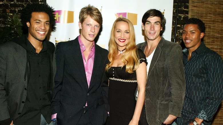 Jerry Hall (center) and some of the men of "Kept"
