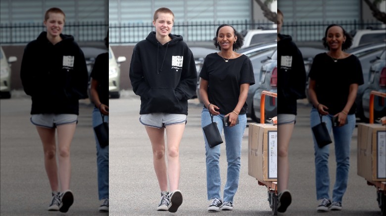 Shiloh and Zahara Jolie-Pitt walking