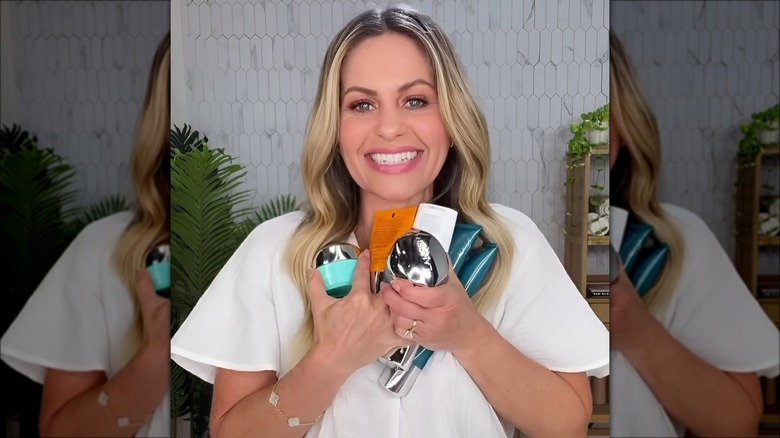 Candace Cameron Bure holding her favorite Lancer products and smiling