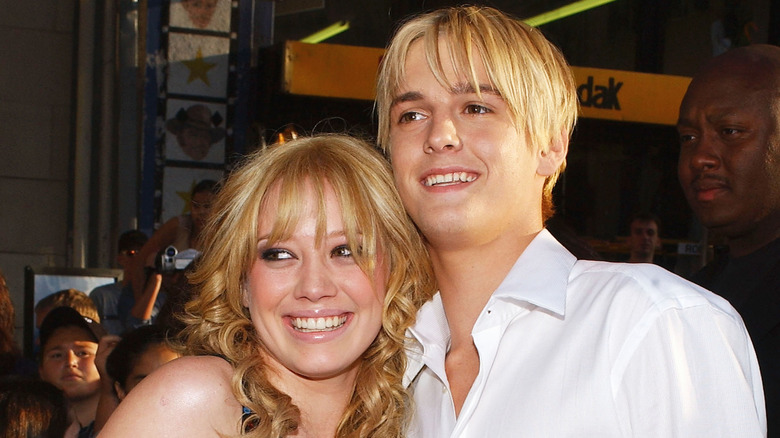 Aaron Carter smiling with Hilary Duff