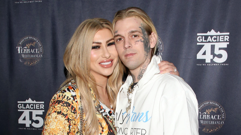 Aaron Carter with Melanie Martin at an event