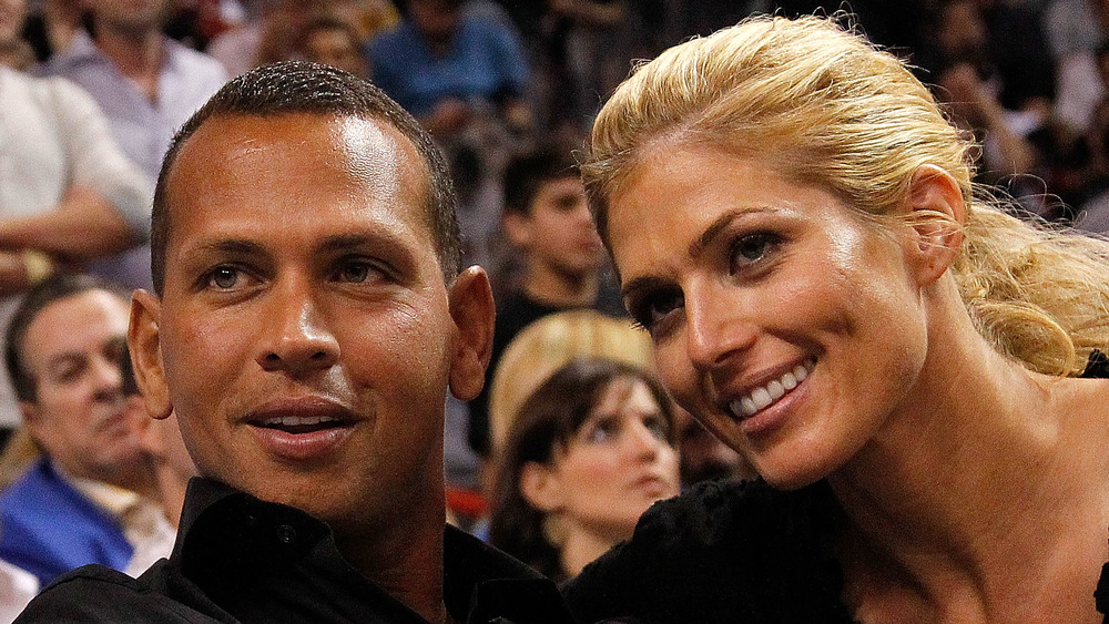 Alex Rodriguez and Torrie Wilson sitting together