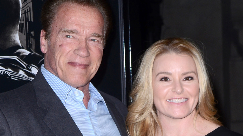 Arnold Schwarzenegger and Heather Milligan smile