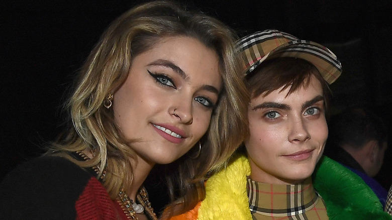 Paris Jackson and Cara Delevingne smiling