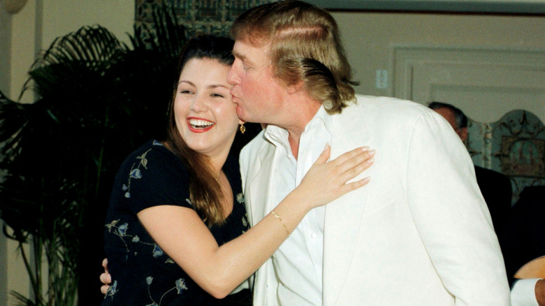 Alicia Machado laughs as Donald Trump kisses her