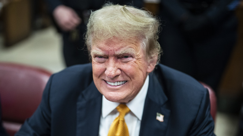 Donald Trump grinning during his criminal trial at Manhattan Criminal Court on May 29, 2024