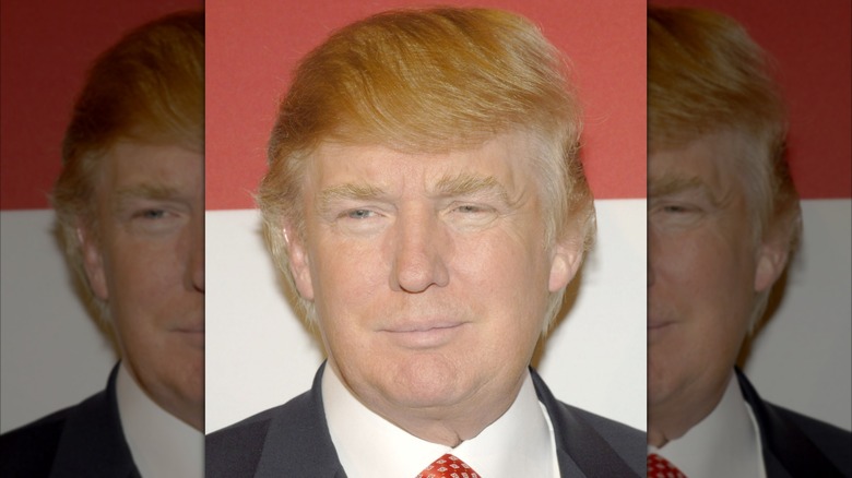 Donald Trump posing at the "Universal Beauty: The Miss Universe Guide to Beauty" Book Launch Party