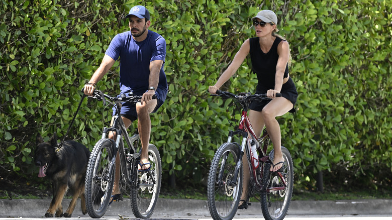 Gisele Bundchen and Joaquim Valente riding bikes