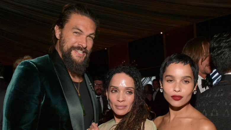 Jason Momoa and Lisa Bonet with Zoe Kravitz at an event 