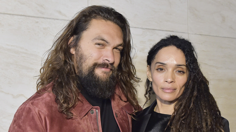 Jason Momoa and Lisa Bonet posing together 