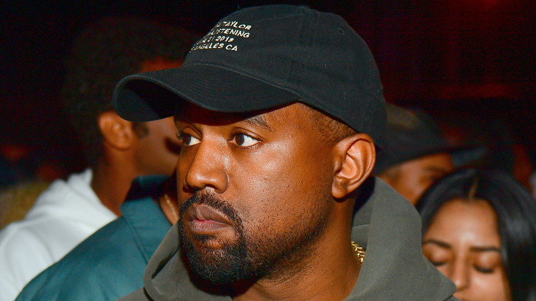 Kanye West wearing a cap