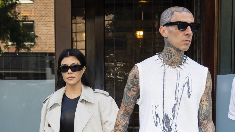 Kourtney Kardashian and Travis Barker walking 