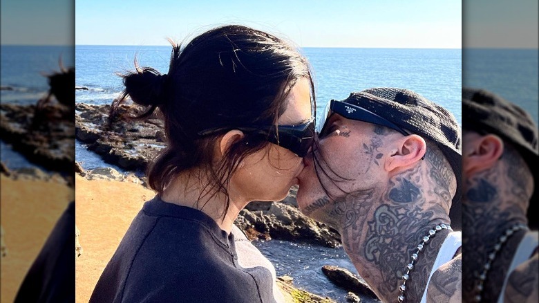 Kourtney Kardashian and Travis Barker kissing 