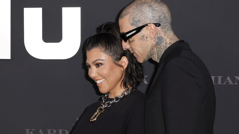 Kourtney Kardashian and Travis Barker smiling