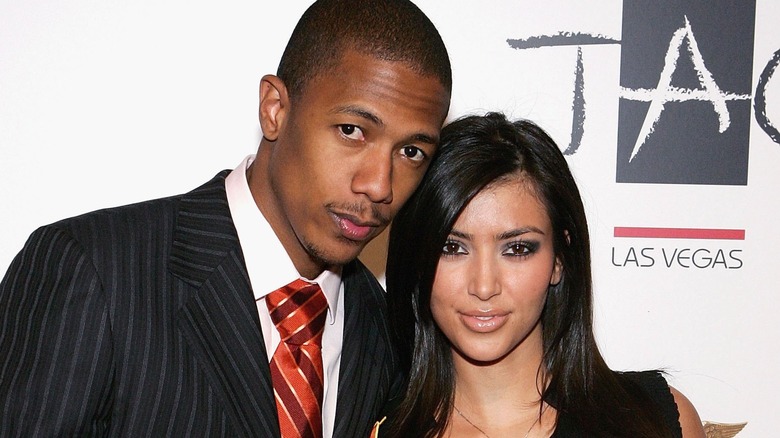 Nick Cannon posing with Kim Kardashian