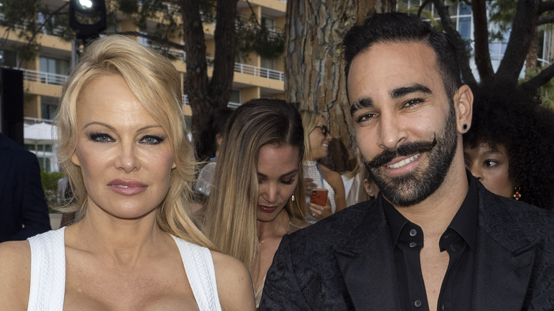 Pamela Anderson and Adil Rami at an event 