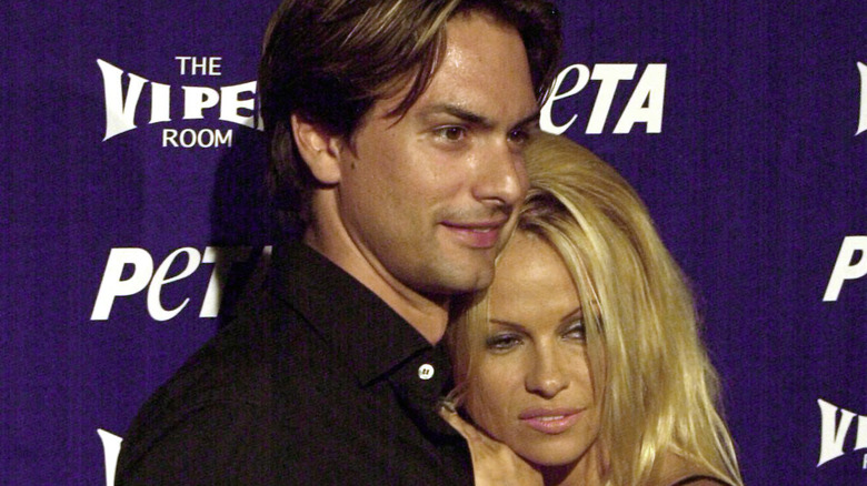 Marcus Schenkenberg and Pamela Anderson at an event 