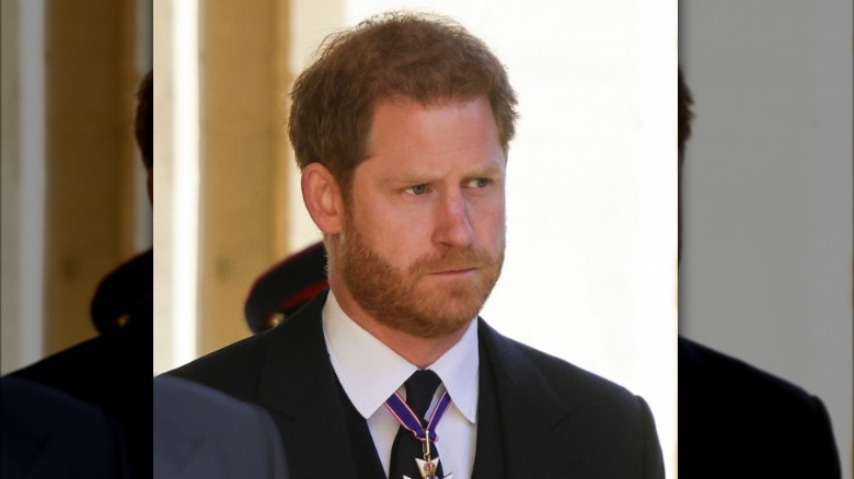 Prince Harry looking sad at his grandfather Prince Philip's funeral