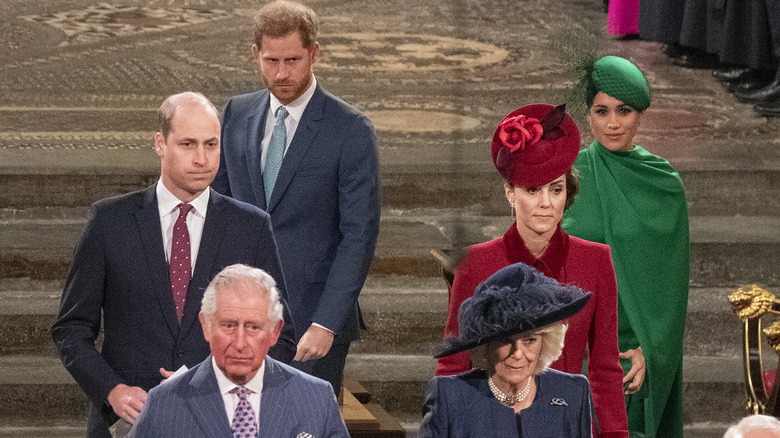 Prince Harry, Meghan Markle, Prince William, Kate Middleton, Prince Charles and Camilla awkwardly walking out of a church