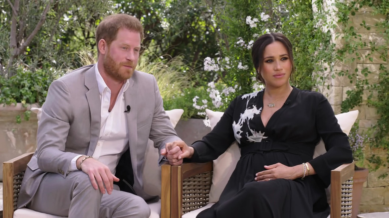 Prince Harry and Meghan Markle talking to Oprah about their struggles