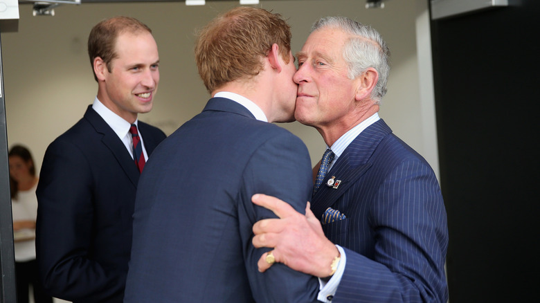 King Charles greeting Prince Harry and Prince William at the Invictus Games Opening Ceremony