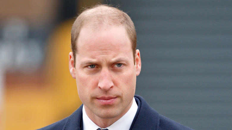 Prince William blue suit solemn