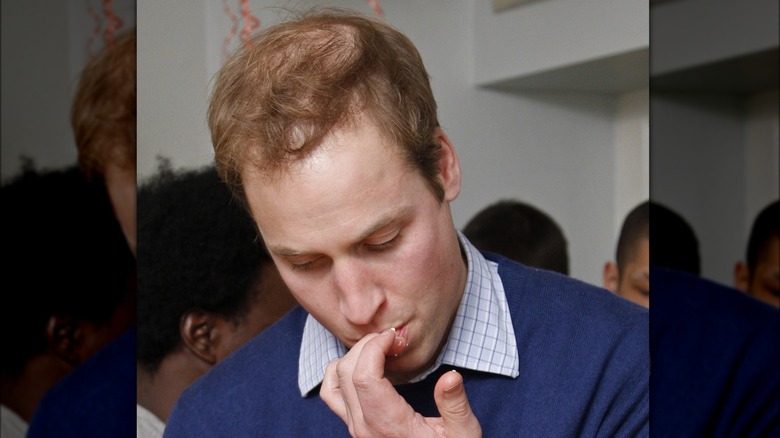 Prince William licking his fingers