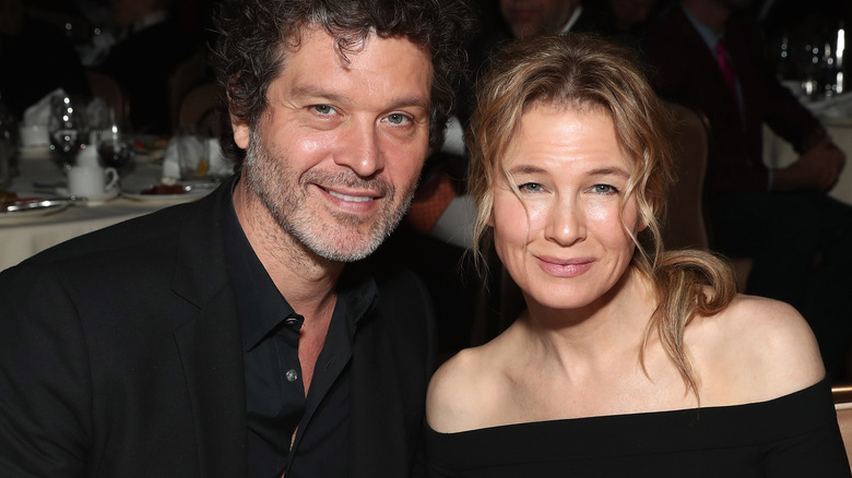 Doyle Bramhall II and Renee Zellweger posing 