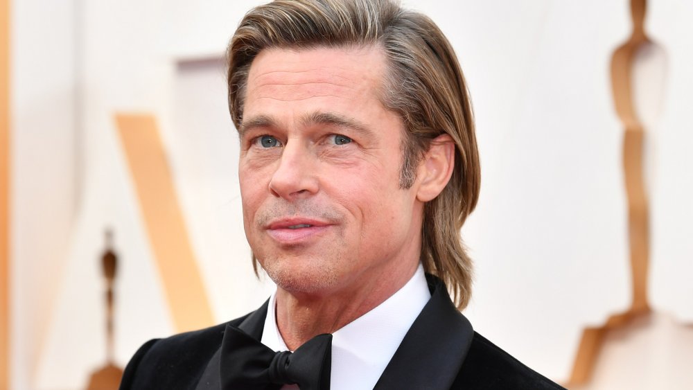 Brad Pitt posing at the 2020 Oscars