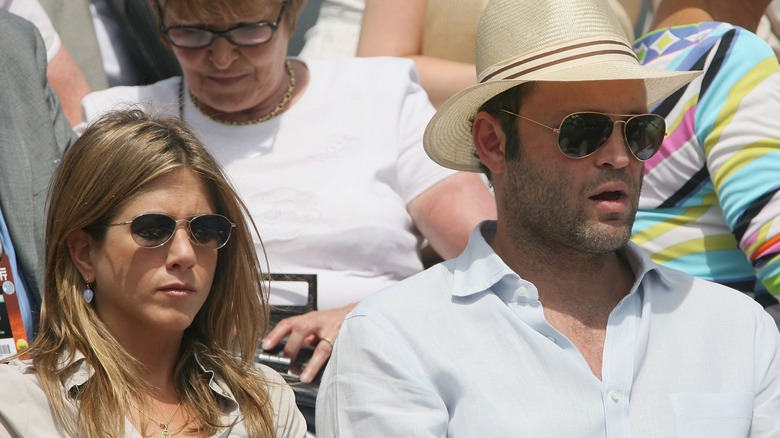 Jennifer Aniston and Vince Vaughn sitting at event