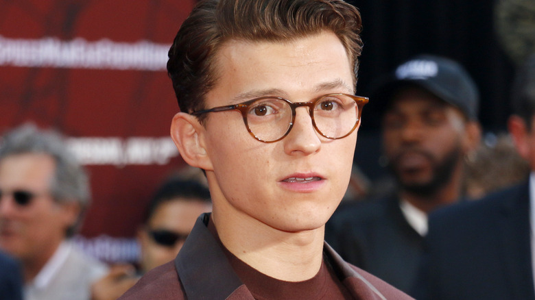 Tom Holland with glasses, posing