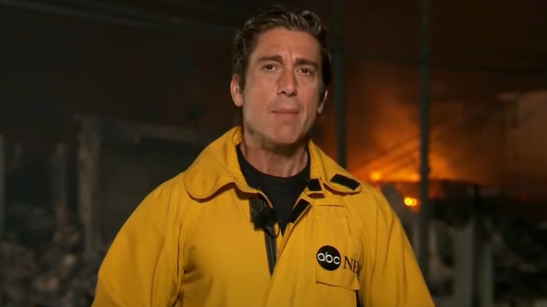 David Muir reporting in yellow jacket