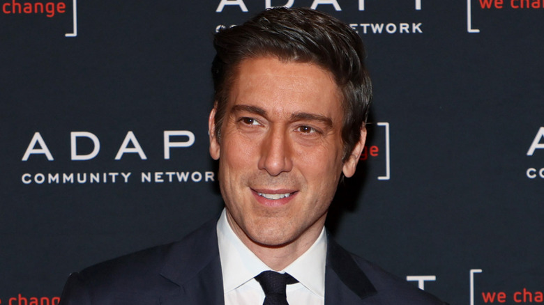 David Muir wearing his hair with a side part