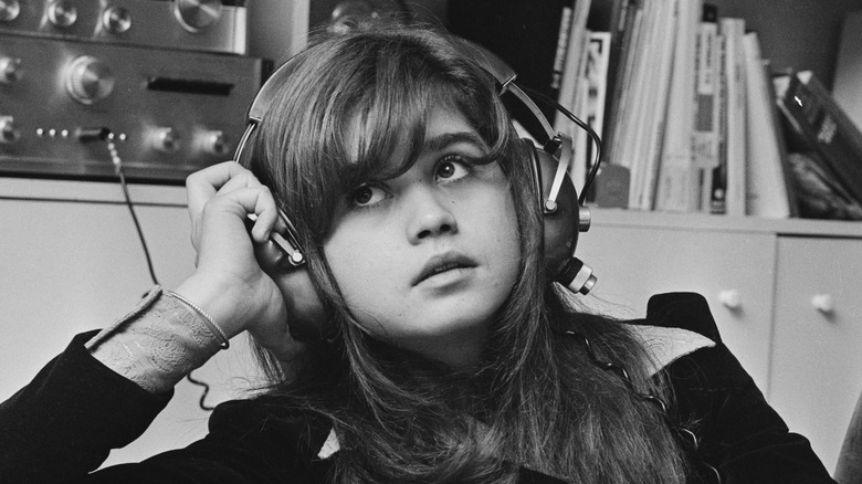 Maria Schneider listening to headphones