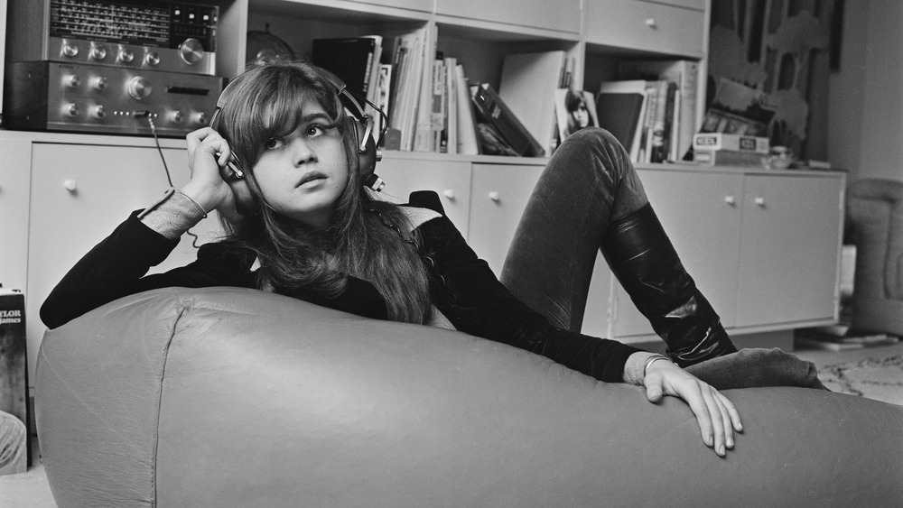 Maria Schneider posing on beanbag chair