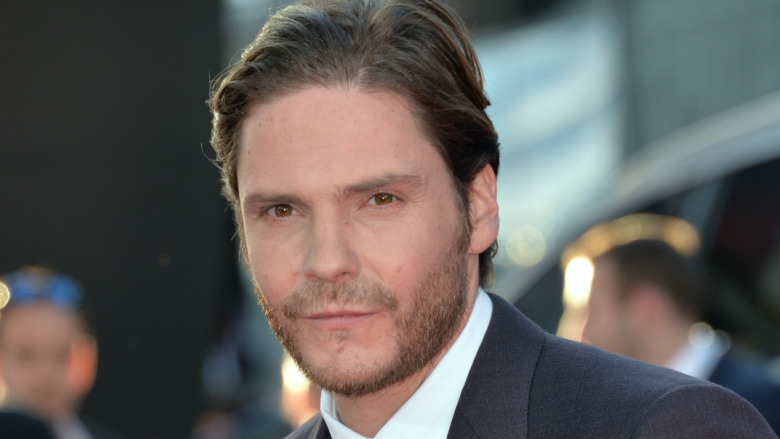 Daniel Bruhl wearing dark gray jacket