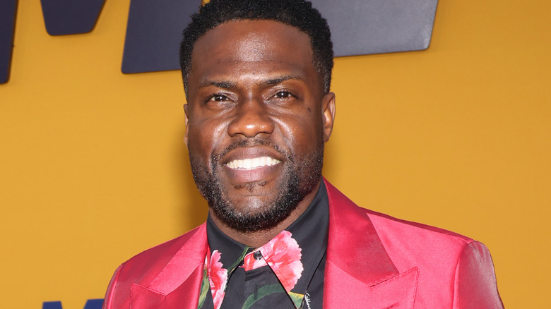 Kevin Hart smiling red suit