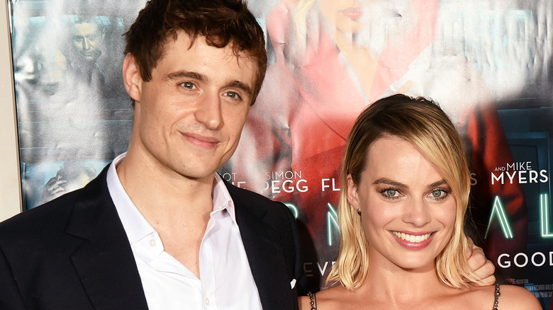 Max Irons and Margot Robbie smiling