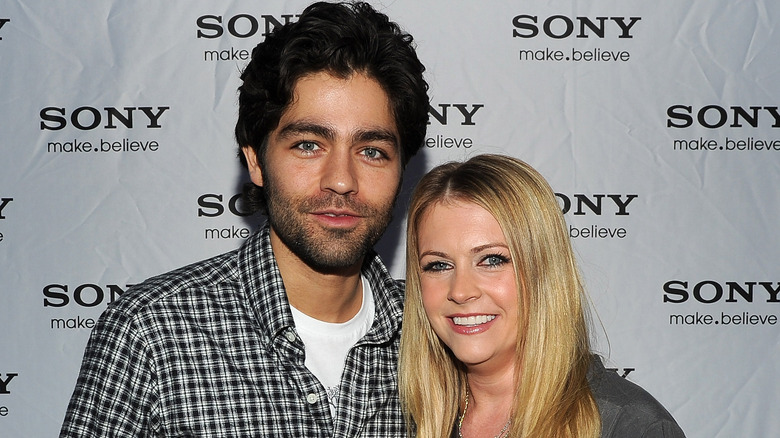 Adrian Grenier and Melissa Joan Hart posing